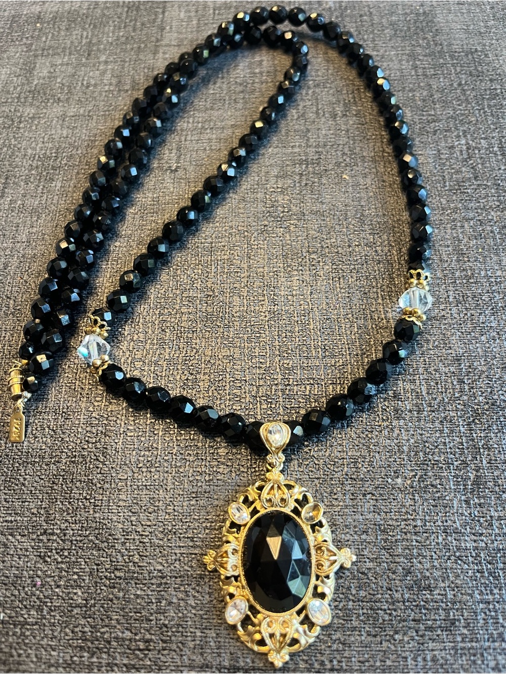 Black crystals and gold tone necklace